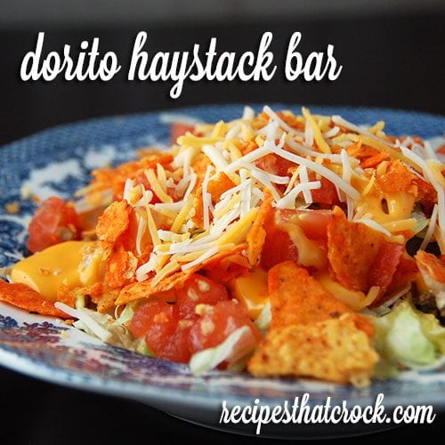 Dorito Haystacks are a delicious spin on a salad bar. Rice, saltines, cheese sauce and ground beef along with all the fixings make for a great meal that everyone can customize to their own taste.