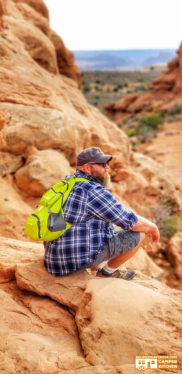 Man hiking Arches National Park