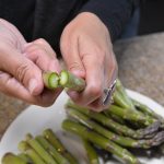 Gently snap off ends of asparagus