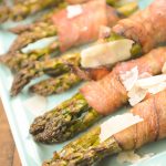 bacon asparagus bundles topped with Parmesan shavings