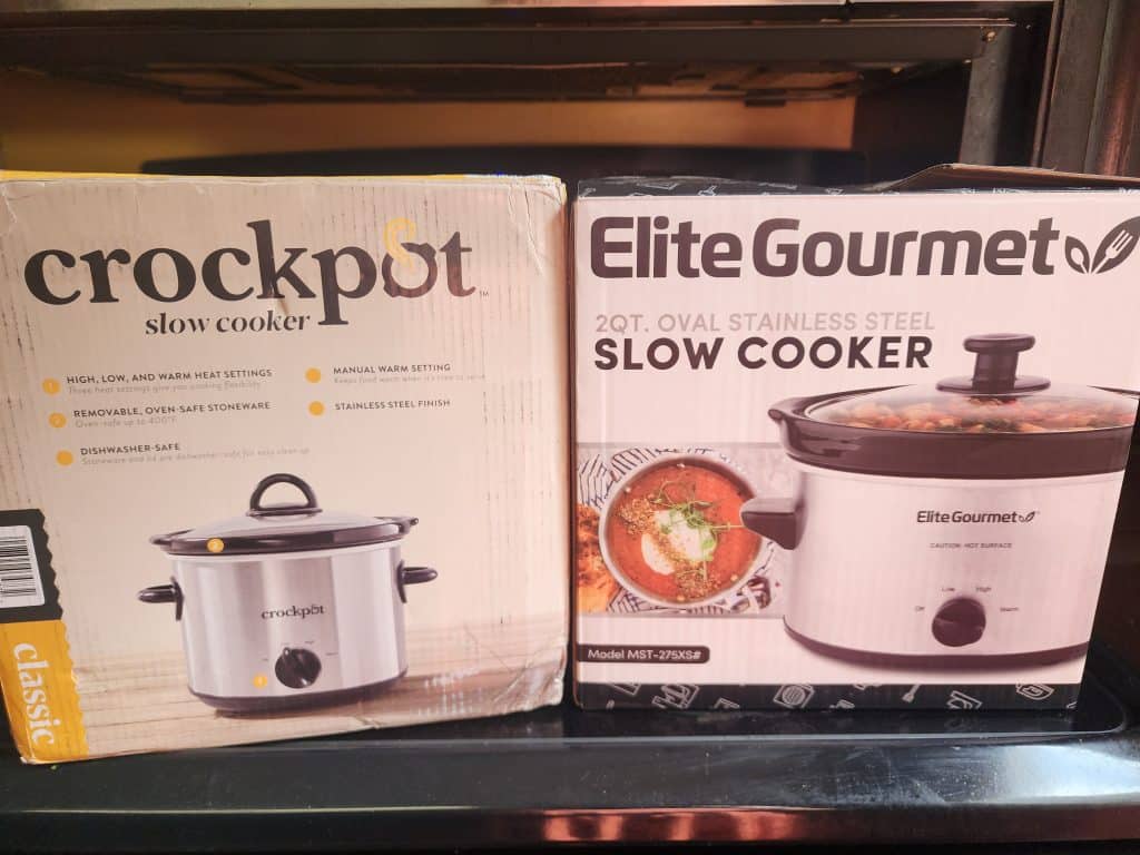 Two boxes of smaller slow cookers.