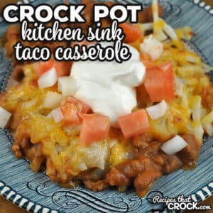 This Kitchen Sink Crock Pot Taco Casserole has it all! The taco beef, refried beans, cheese and shredded hash browns all come together to give you comfort food at its best!