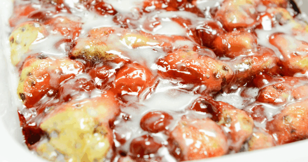 Our Cinnamon Roll Crock Pot Cherry Cobbler is so good you will NOT believe it only has two simple ingredients. This is a fantastic sweet treat for breakfast or dessert and is impressive enough for the holidays! No one will know how easy it was to throw together!
