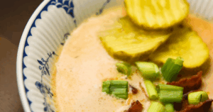 Are you looking for an easy crock pot soup? Our Crock Pot Bacon Cheeseburger Soup is full of flavor and a family favorite. Savory bits of burger, bacon and some veggies thrown in for good measure in a creamy cheese based soup. And our secret ingredient that makes all the difference- pickles!