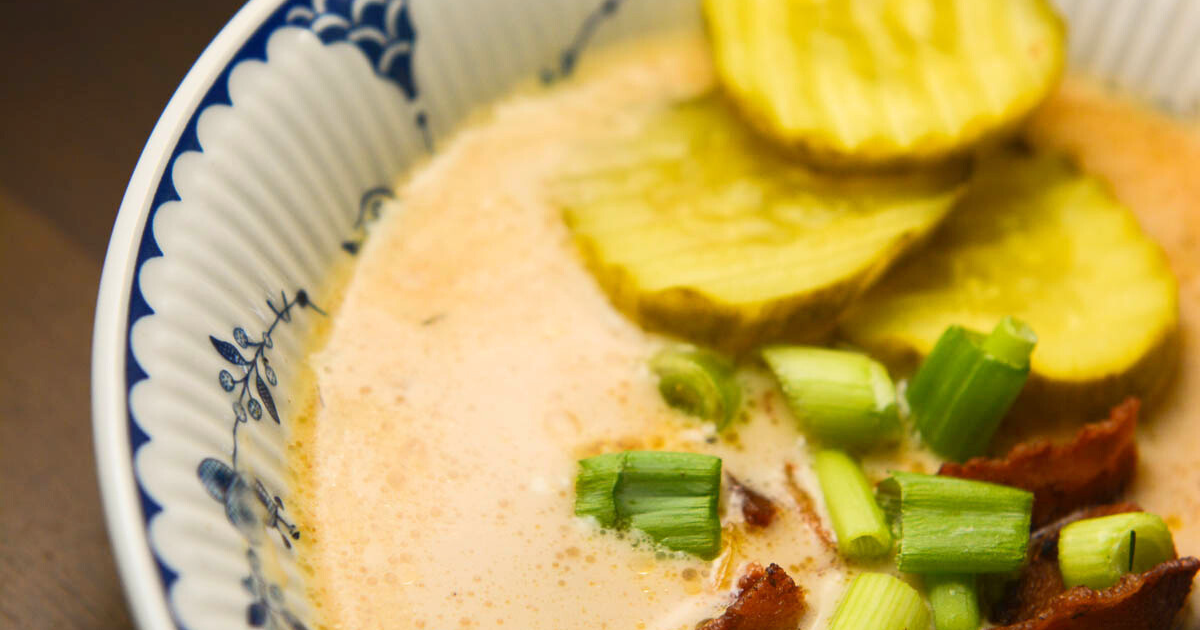 Are you looking for an easy crock pot soup? Our Crock Pot Bacon Cheeseburger Soup is full of flavor and a family favorite. Savory bits of burger, bacon and some veggies thrown in for good measure in a creamy cheese based soup. And our secret ingredient that makes all the difference- pickles!