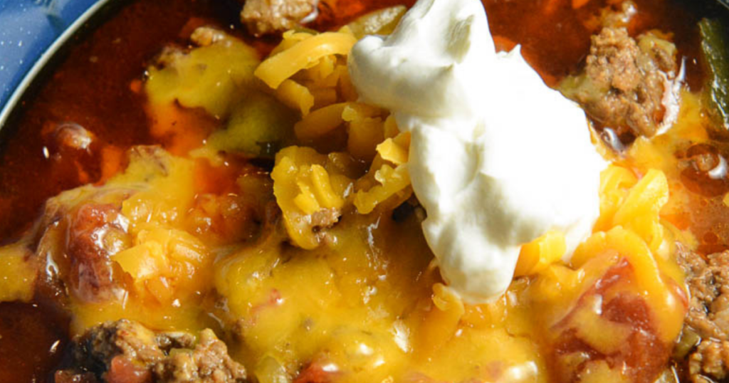 This Crockpot Taco Chili has been reader-tested and approved for years! Home cooks regularly call it excellent, amazing and a permanent addition to their dinner rotation. Made with simple ingredients like ground beef, taco seasoning, diced tomatoes, zucchini and green chilies, this slow cooker chili delivers rich, smoky flavor every single time. Customize it with your favorite toppings and make it your own. Tried, true and totally delicious.